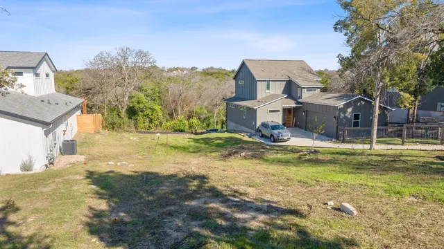 a view of a house with pool and yard