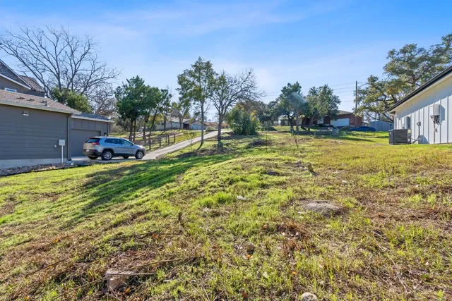 a swimming pool with outdoor seating and yard
