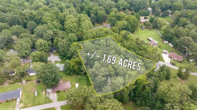 an aerial view of a houses with yard