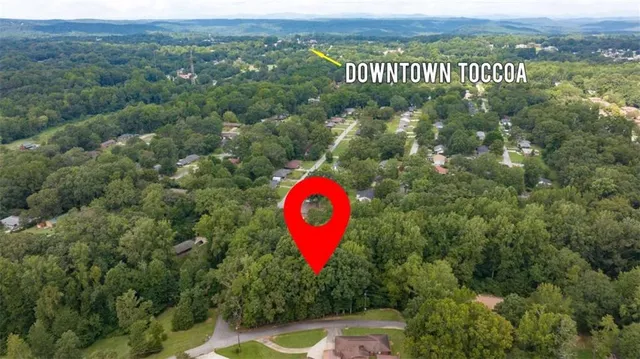 an aerial view of a house with a swimming pool