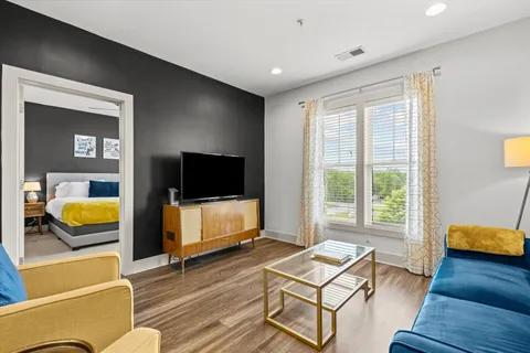 a living room with furniture and a flat screen tv