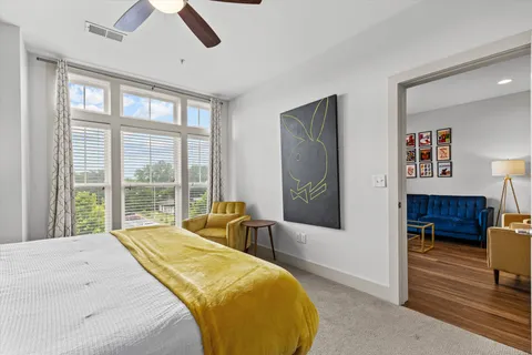 a bedroom with a bed and a view of bathroom