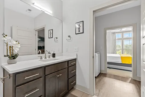 a en suite bathroom with a sink and a mirror