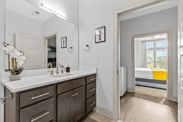 a en suite bathroom with a sink and a mirror