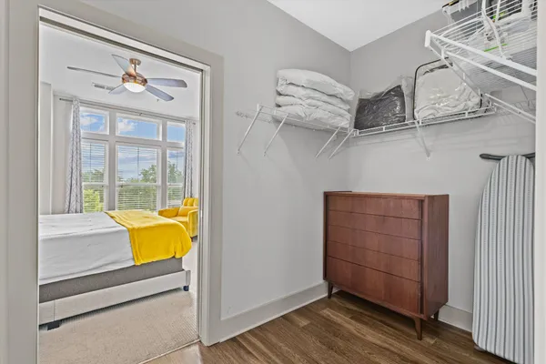 a view of a room with wooden floor and cabinet