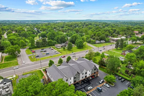 an aerial view of a house with outdoor space