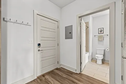 a view of a bathroom with a toilet and a shower