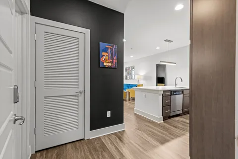 a kitchen with a refrigerator and a stove