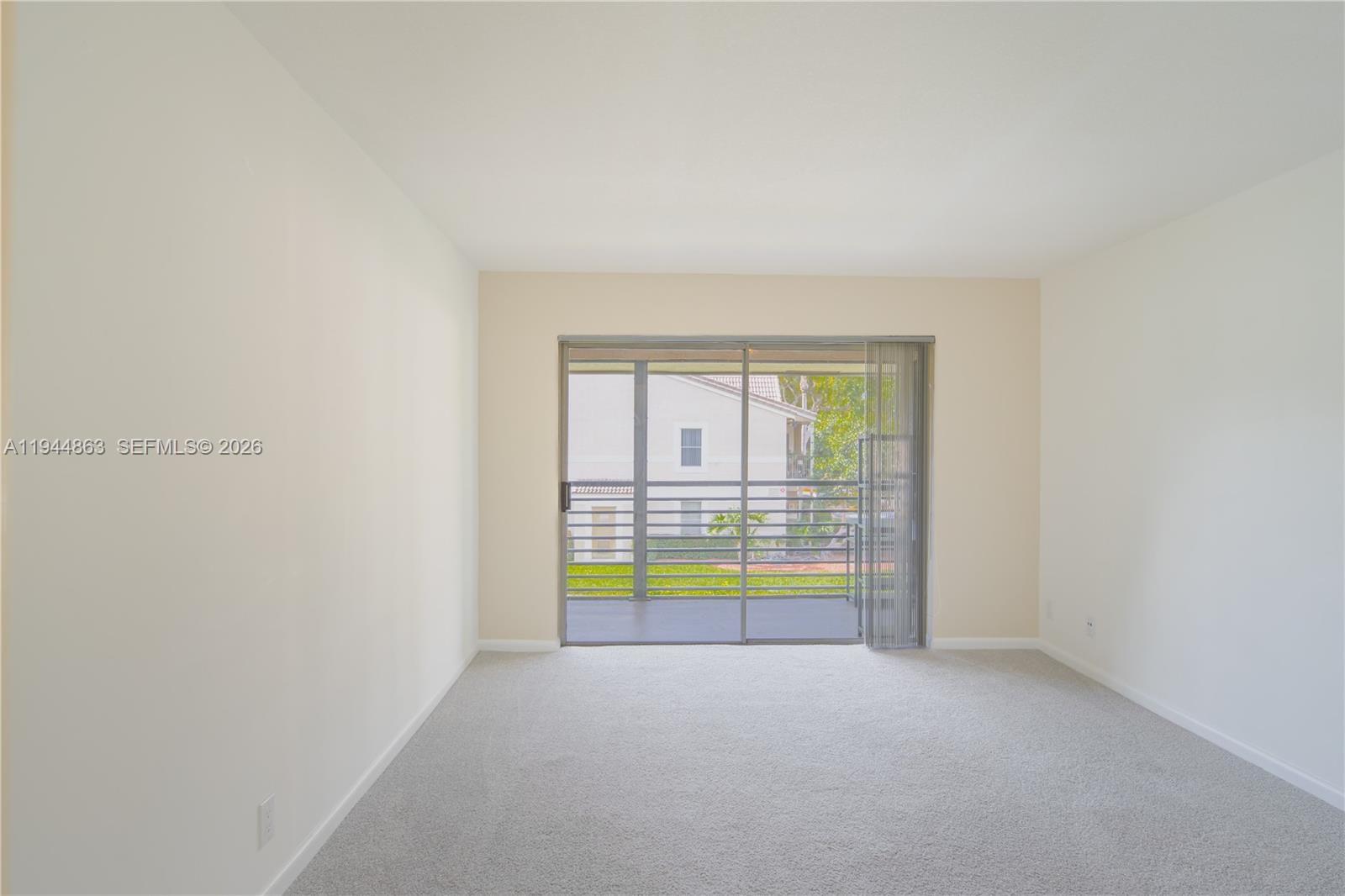 2830 Riverside Drive, Unit 2013 Coral Springs, FL 33065 - Photo 13 of 14 a view of an empty room with a window