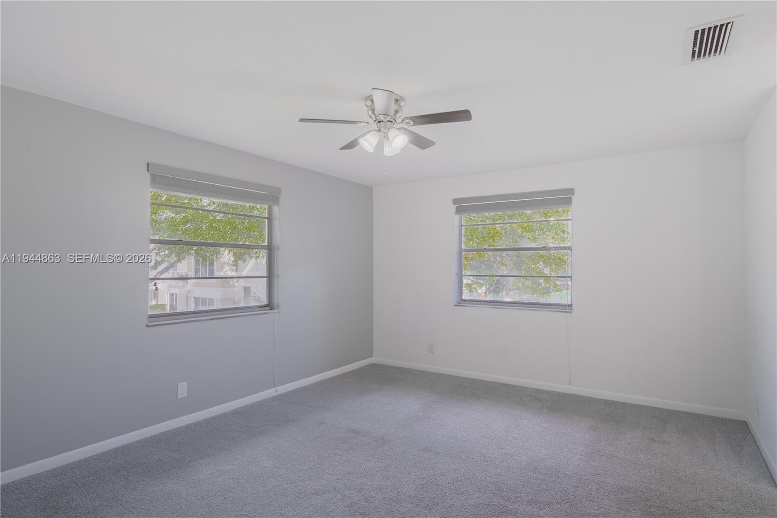 2830 Riverside Drive, Unit 2013 Coral Springs, FL 33065 - Photo 7 of 14 a view of an empty room with a window