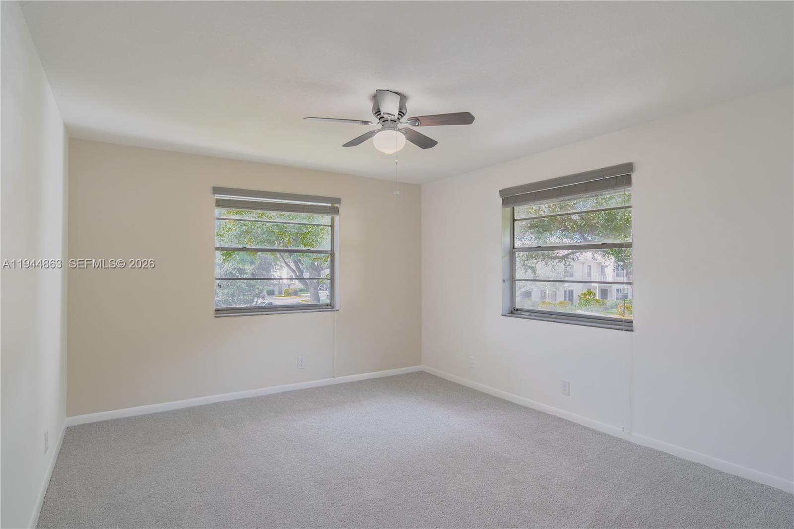 2830 Riverside Drive, Unit 2013 Coral Springs, FL 33065 - Photo 10 of 14 a view of an empty room with a window