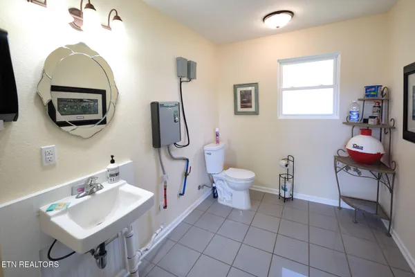 a bedroom with furniture and a flat screen tv