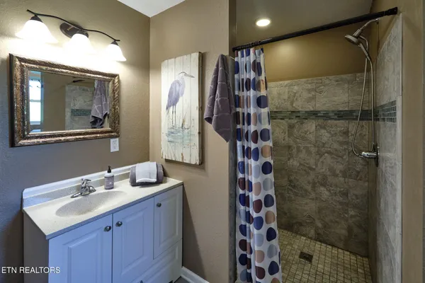 a view of balcony and floor with wooden floor and lake view