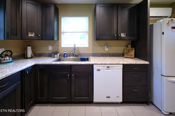 a bathroom with a toilet mirror and tub