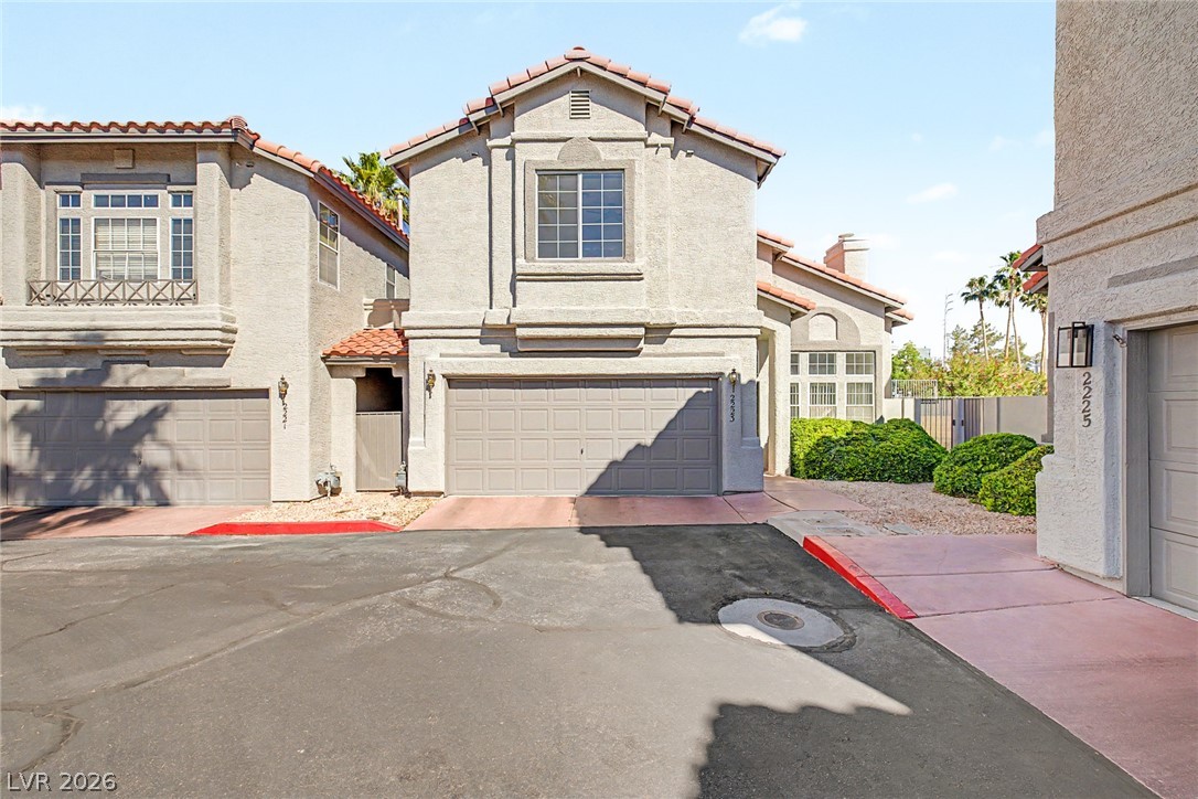 2223 Ramsgate Drive Henderson, NV 89074 - Photo 1 of 32 A classic stucco exterior welcomes you home, complete with an attached garage and well-maintained landscaping.