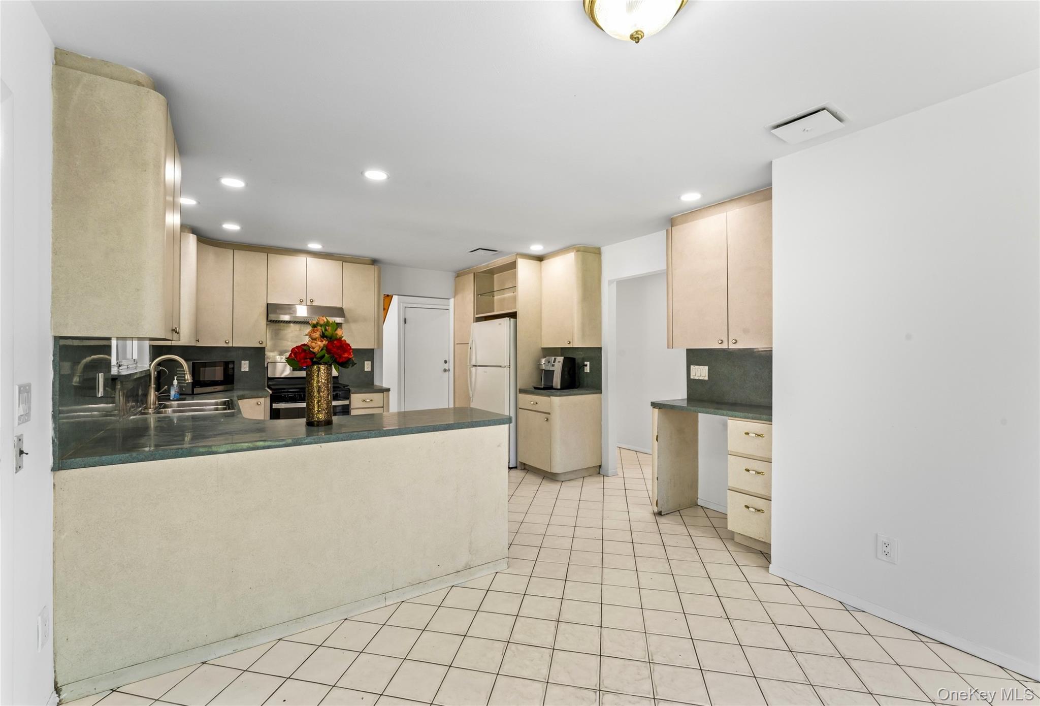 126 Bagatelle Road Melville, NY 11747 - Photo 18 of 50 a view of kitchen with furniture and refrigerator