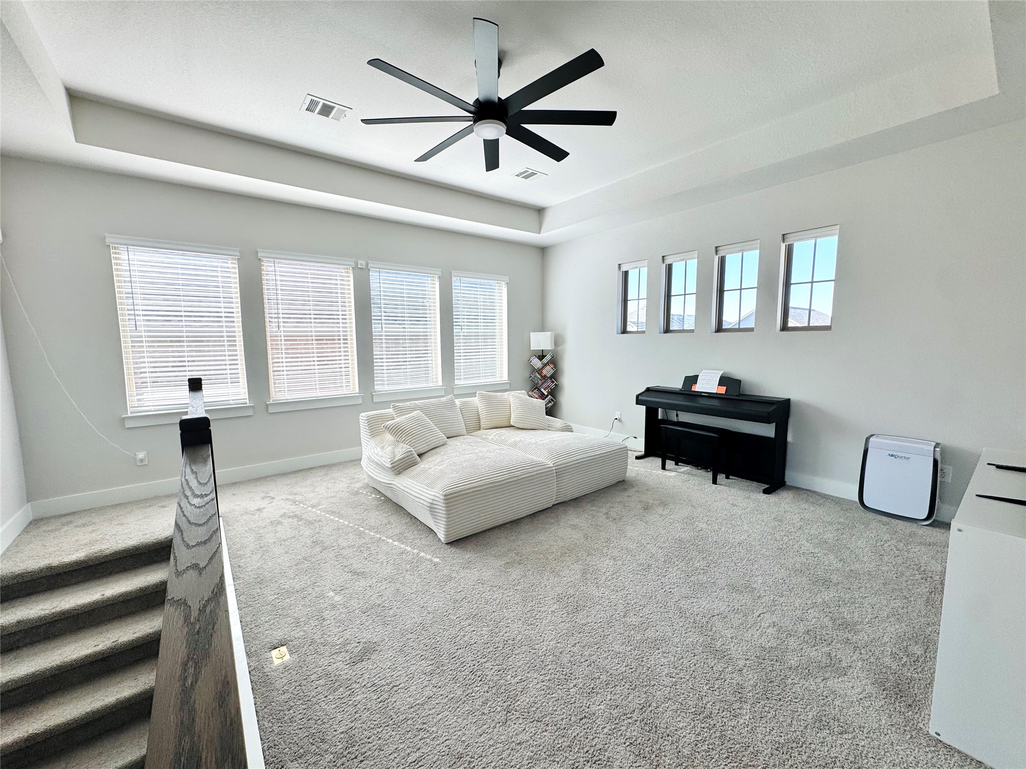 561 Cold Riv Run Kyle, TX 78640 - Photo 14 of 33 a spacious bedroom with a bed and a chandelier