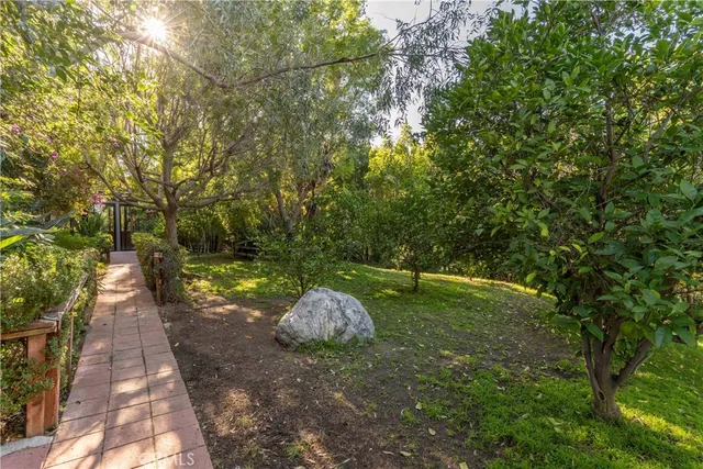 a backyard of a house with lots of green space