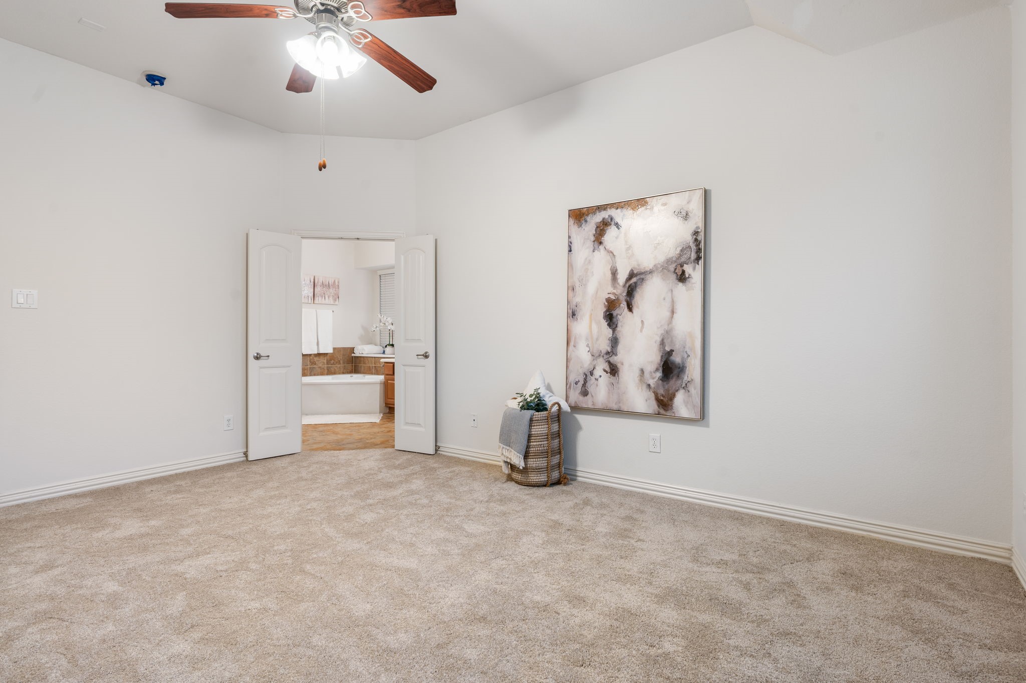 307 Arbor Ridge Lane Conroe, TX 77384 - Photo 19 of 50 an empty room with chandelier fan and windows