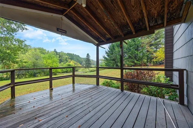 a view of wooden deck with a yard
