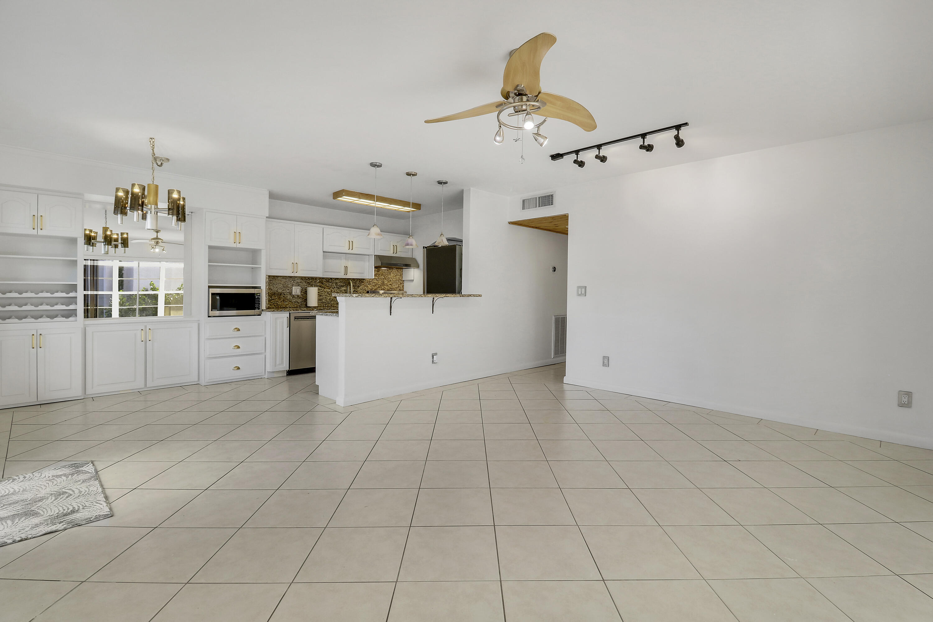 964 Northwest Spruce Ridge Drive, Unit D1 Stuart, FL 34994 - Photo 15 of 33 Living Space & Kitchen