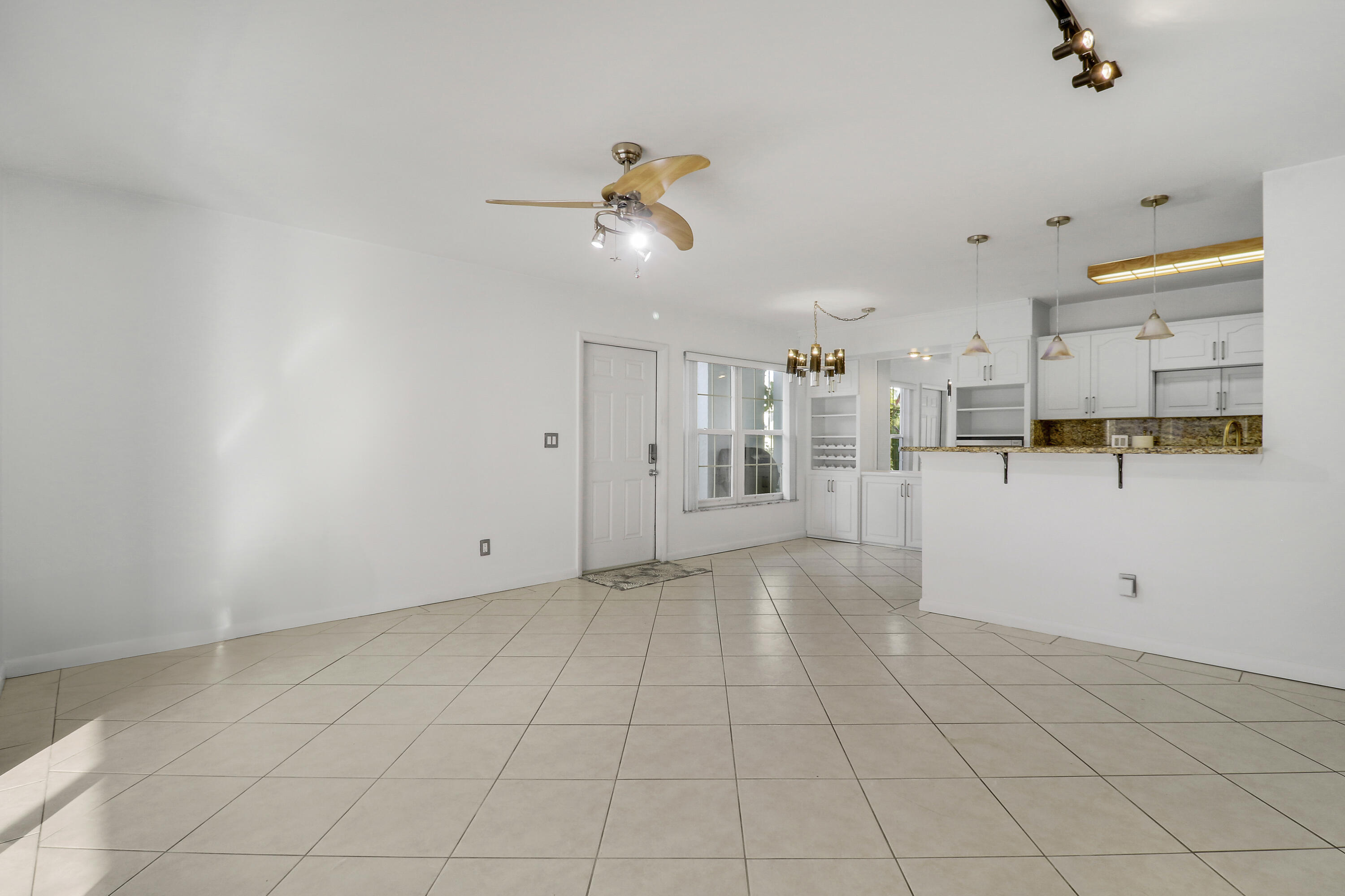 964 Northwest Spruce Ridge Drive, Unit D1 Stuart, FL 34994 - Photo 17 of 33 Living Space & Kitchen