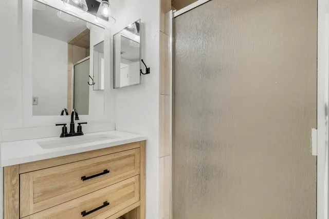 a view of an empty room with a window