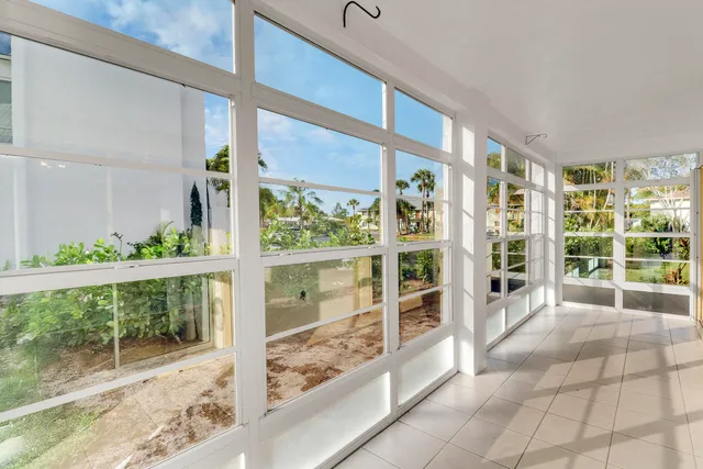 a swimming pool view with a outdoor seating