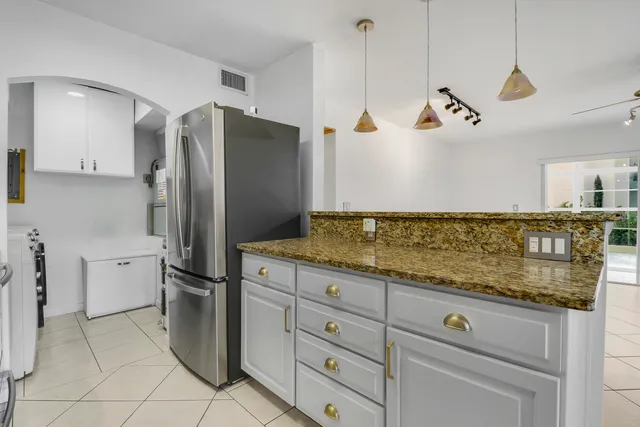 a view of a refrigerator and window