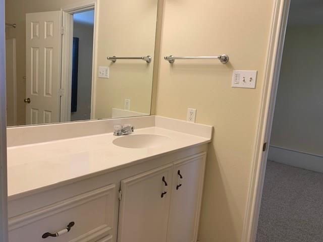 1922 20th Street Huntsville, TX 77340 - Photo 20 of 49 a bathroom with a sink and a mirror