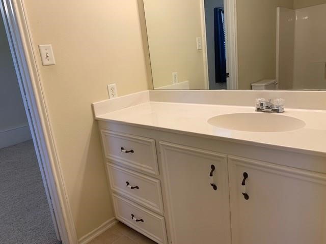 1922 20th Street Huntsville, TX 77340 - Photo 22 of 49 a bathroom with a sink and a mirror