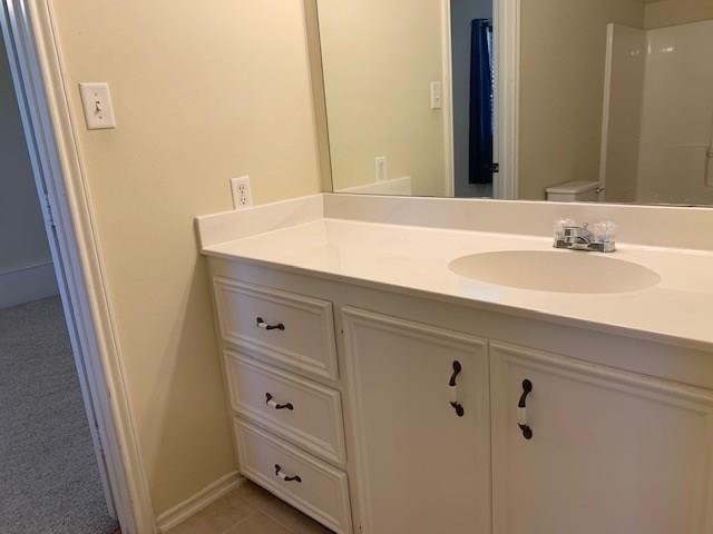 1922 20th Street Huntsville, TX 77340 - Photo 23 of 49 a bathroom with a sink and a mirror