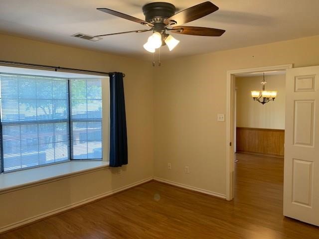 1922 20th Street Huntsville, TX 77340 - Photo 38 of 49 an empty room with wooden floor fan and windows