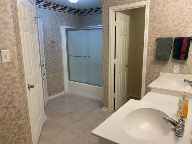 1922 20th Street Huntsville, TX 77340 - Photo 39 of 49 a bathroom with a tub and shower