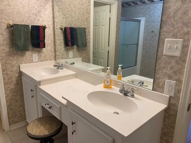 1922 20th Street Huntsville, TX 77340 - Photo 40 of 49 a bathroom with a sink and a mirror with toilet