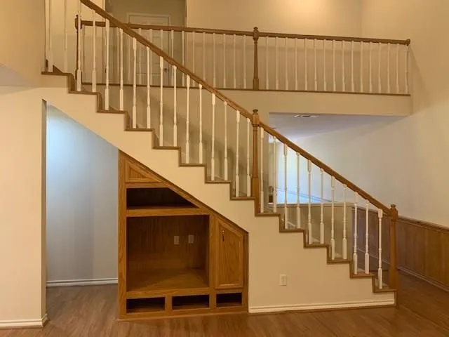 a view of entryway with wooden floor