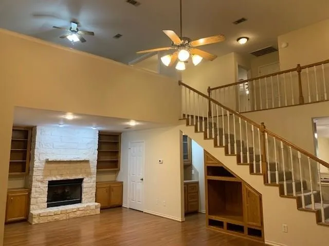 a view of an entryway with wooden floor and a fire place