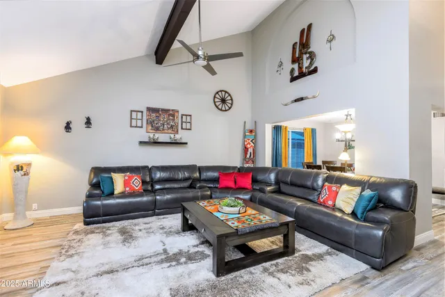 a living room with furniture and a rug