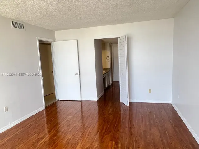 a view of a hallway with windows