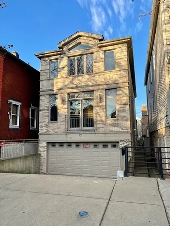 a front view of a house with glass windows