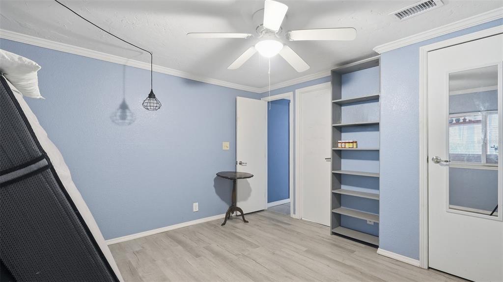 10565 Bessemer Street New Port Richey, FL 34654 - Photo 19 of 72 a view of a hallway with wooden floor and closet