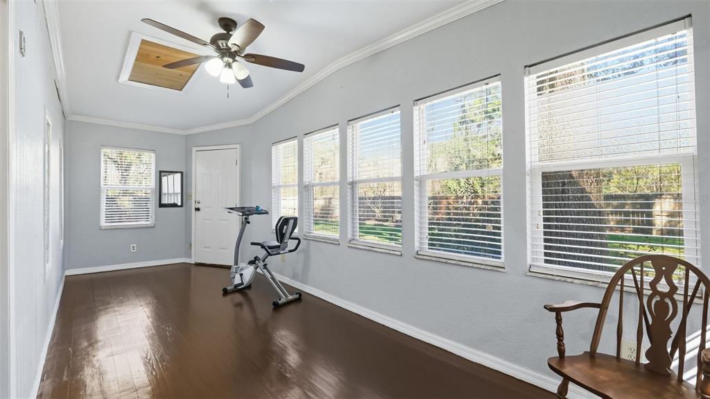 10565 Bessemer Street New Port Richey, FL 34654 - Photo 25 of 72 a view of a workspace with furniture and a window