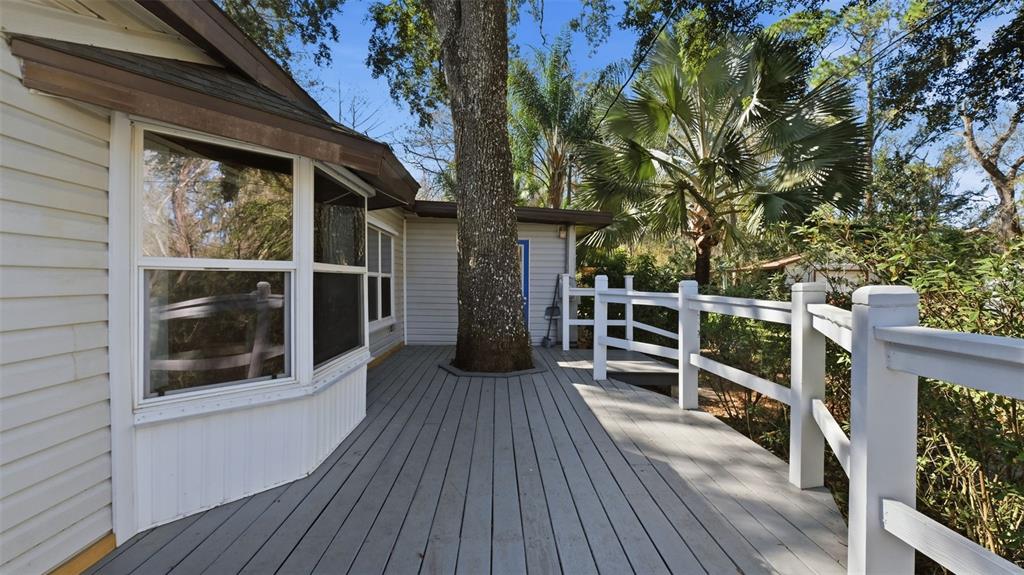10565 Bessemer Street New Port Richey, FL 34654 - Photo 42 of 72 a view of a balcony with wooden floor and fence