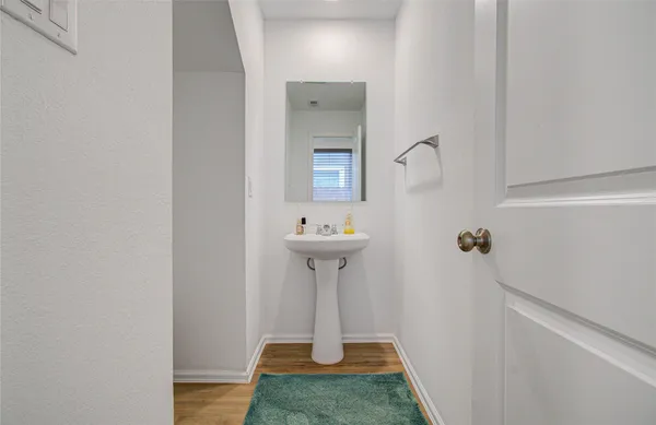 a bathroom with a sink and mirror