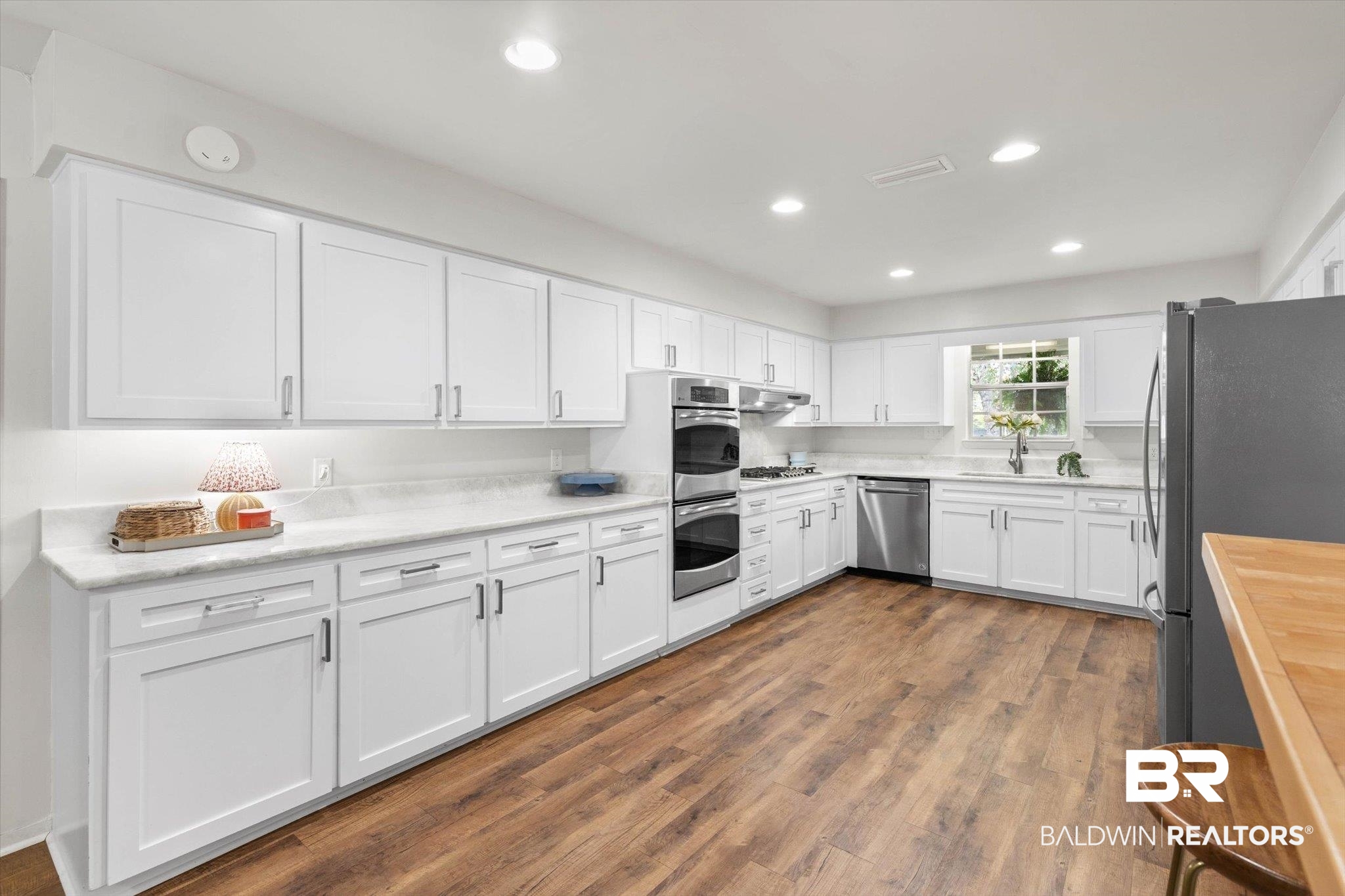 254 Woodlands Avenue Mobile, AL 36607 - Photo 8 of 50 Kitchen featuring white cabinets, recessed lighting, dark wood-style flooring, stainless steel appliances, and butcher block countertops