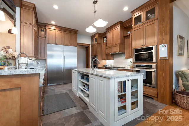 a view of a kitchen with appliances and cabinets