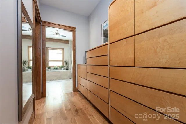 a bedroom with a bed and a book shelf