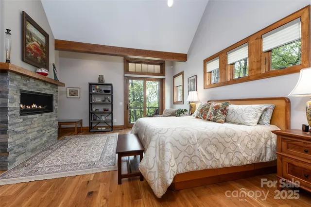 a bed room with a bed and a television