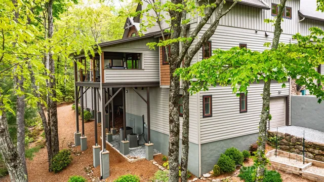 a view of a house with a tree