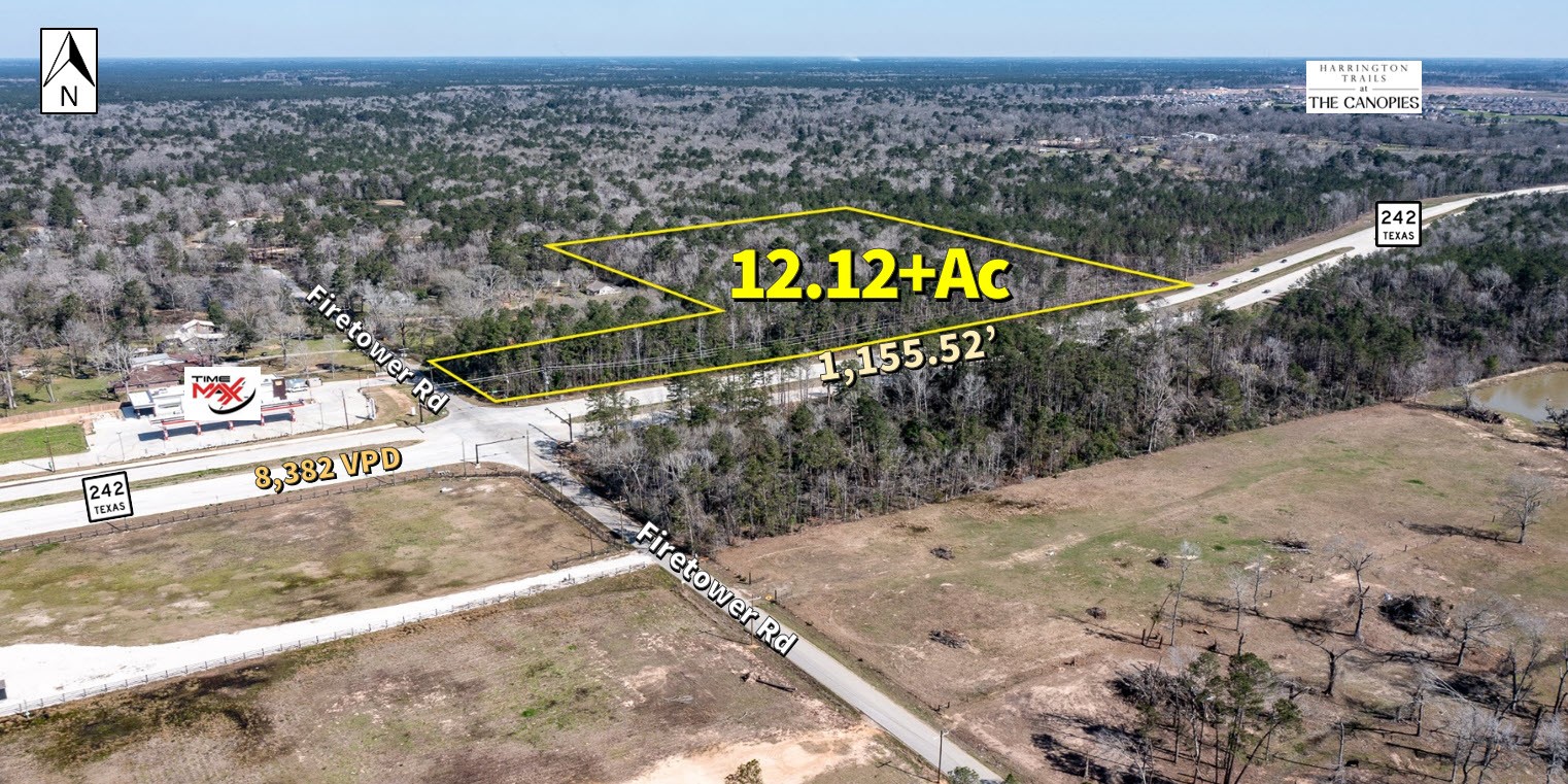 20201 Highway 242 Conroe, TX 77306 - Photo 1 of 10 a sign on the side of a road